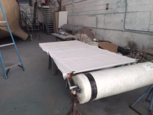 Fiberglass roll on standby for its "tailoring"